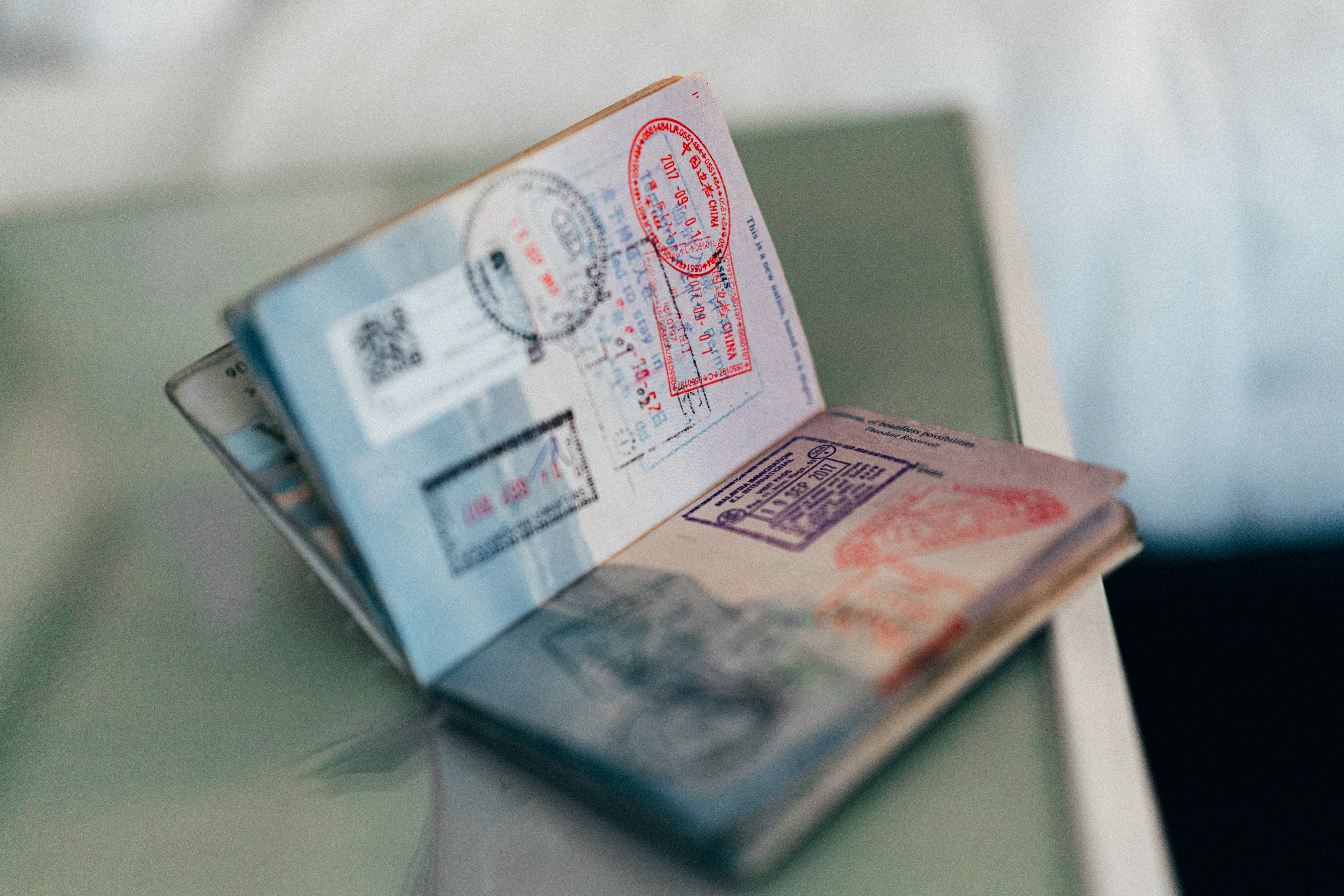 a passport with various travel stamps